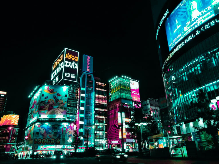 City Buildings With Lights during Night Time